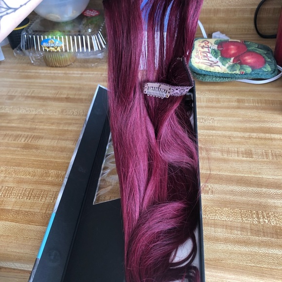 Magenta/red hair extensions